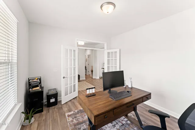 a view of a workspace with furniture