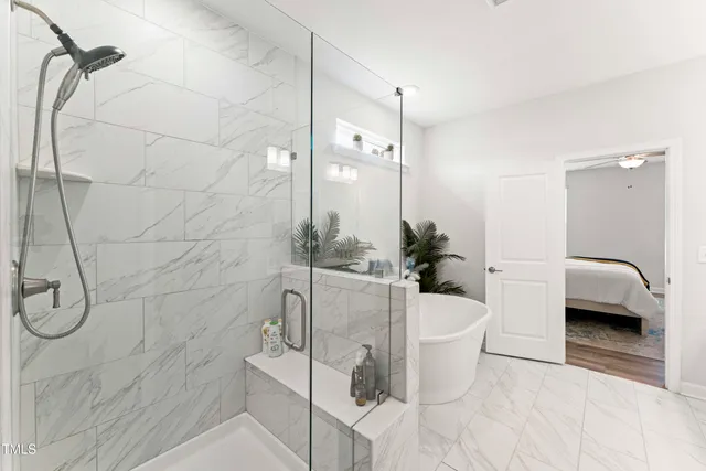 a white bath tub sitting next to a white tub