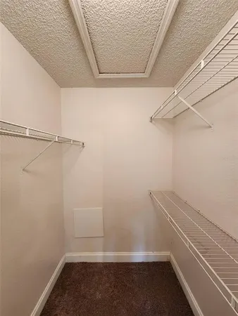 a view of a room with racks on the wall