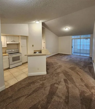 a view of a kitchen with a sink