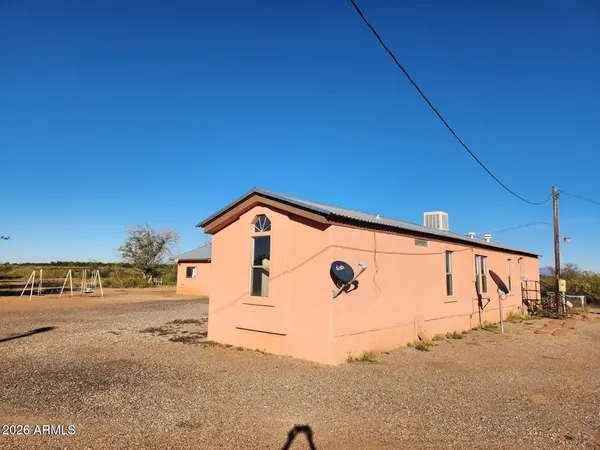 a view of a house with a street