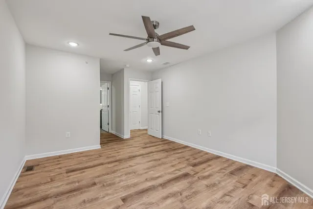 a bathroom with a shower and a sink
