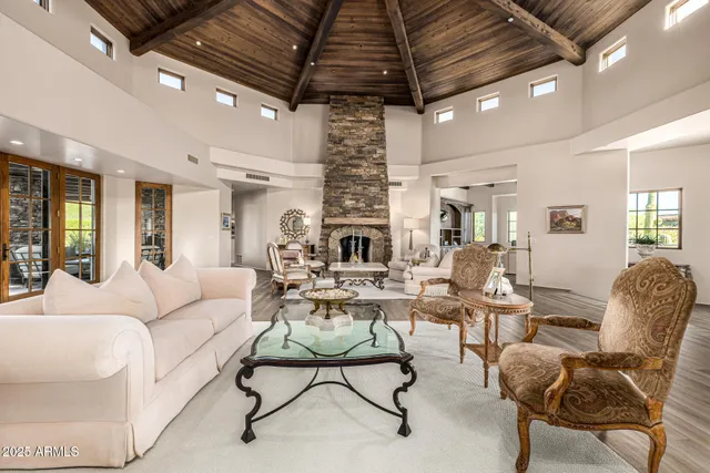 a dining room with furniture a rug and wooden floor