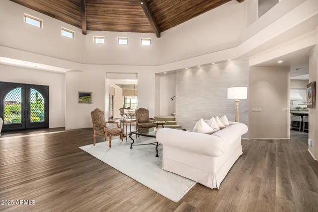 a living room with furniture and a large window