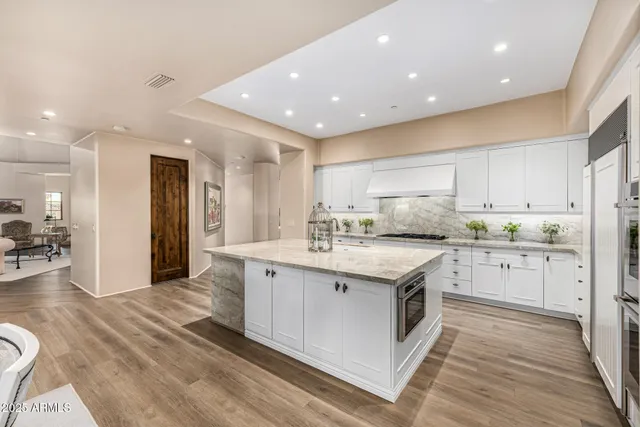 a large spacious bathroom with a double vanity sink and a large mirror
