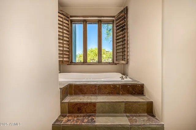 a living room with couches and a large window