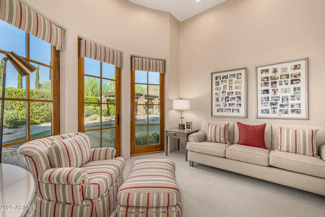 a living room with furniture a fireplace and a table