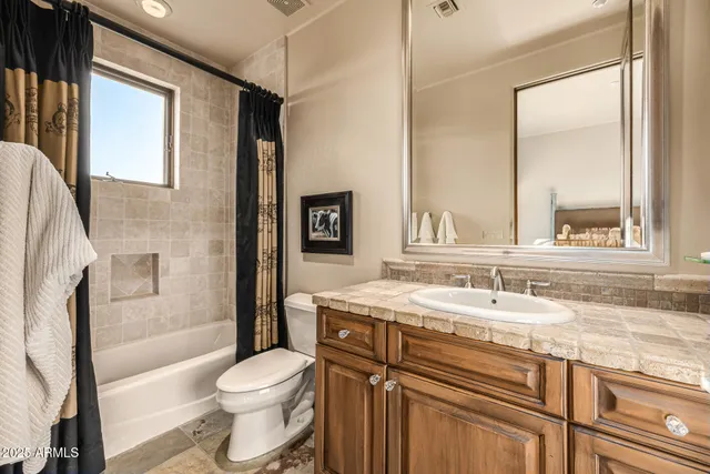 an aerial view of a house with yard swimming pool and outdoor seating