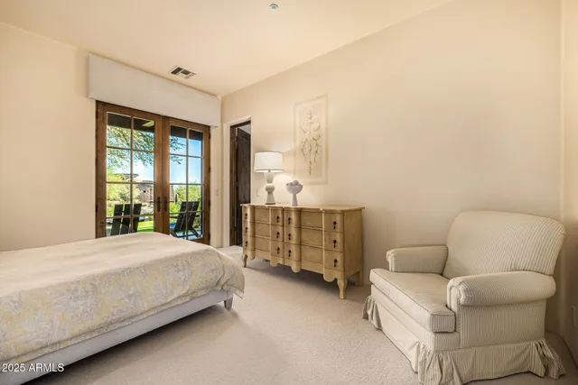 an aerial view of a house with a yard and a fountain