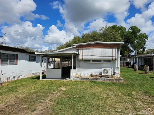 a view of a house with backyard