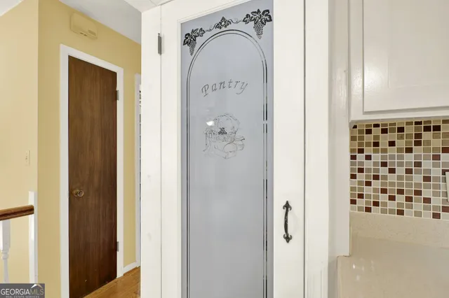 a view of a hallway with windows