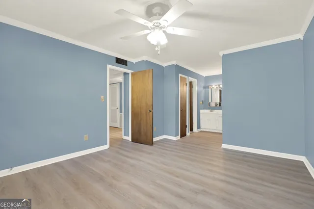 a bathroom with a sink vanity and mirror