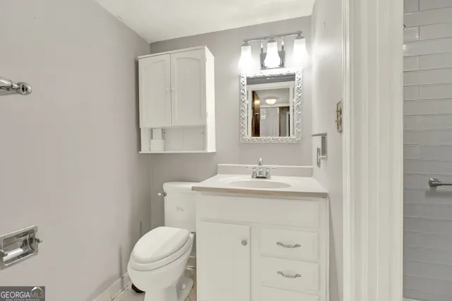 a bathroom with a shower and a toilet