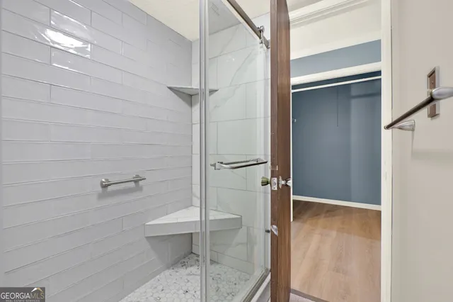 a view of a patio with table and chairs and potted plants