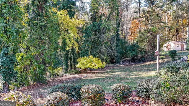 a backyard of a house with lots of green space