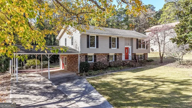 a front view of a house with a yard