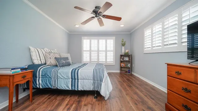 a view of a patio with table and chairs and potted plants with sky view