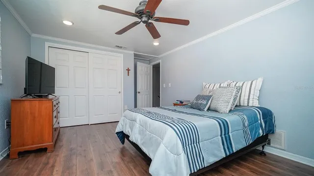 a view of a swimming pool with a patio and a yard