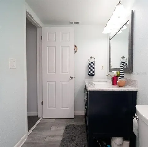 an aerial view of a house with a yard table and chairs