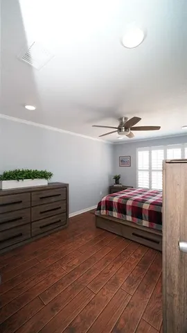 an aerial view of a house with a yard and parking spaces