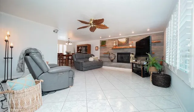 a view of living room with furniture and a flat screen tv