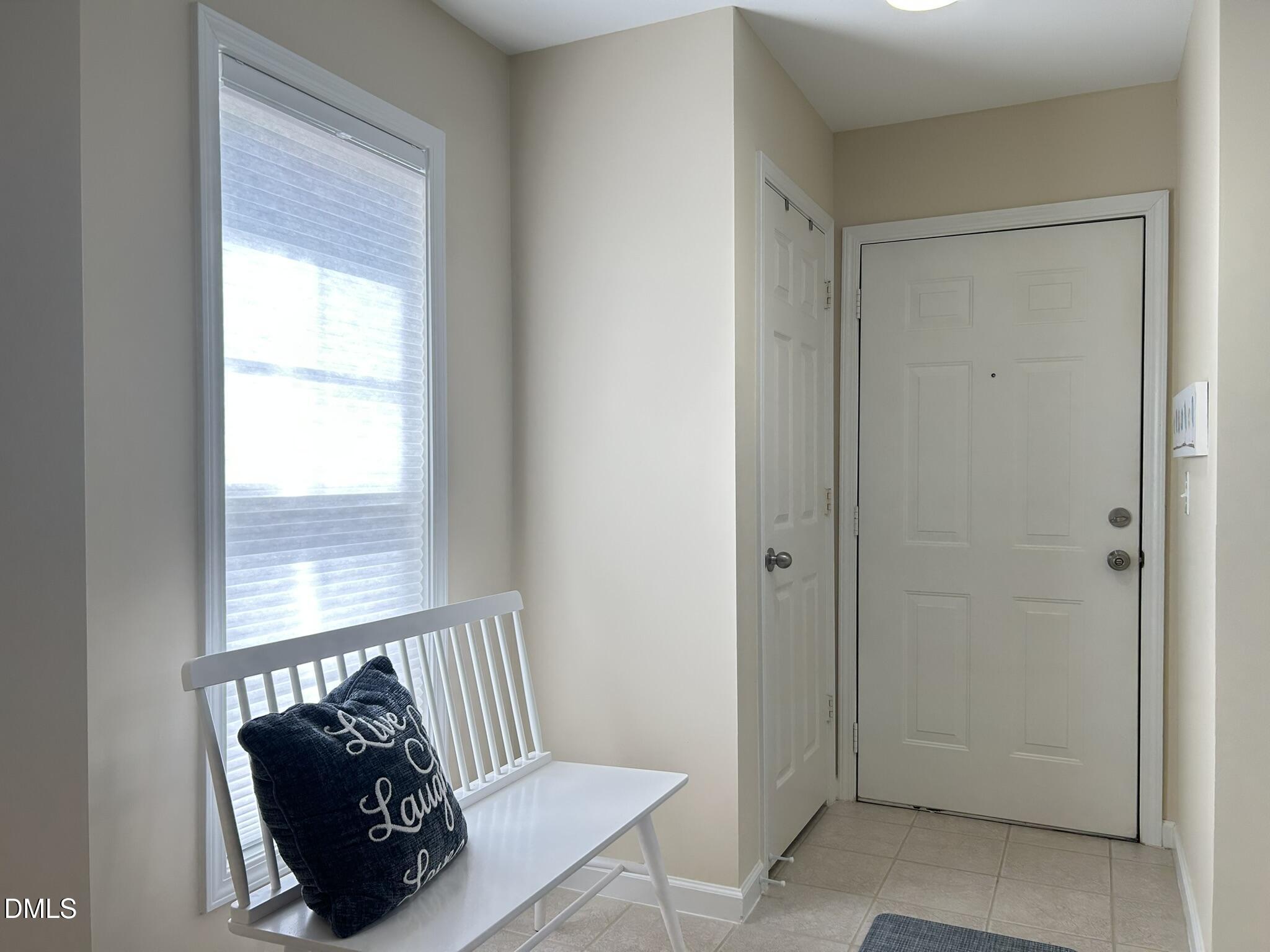 2510 Friedland Place, Unit 102 Raleigh, NC 27617 - Photo 4 of 42 a living room with furniture and a window
