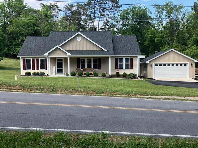 2348 East Ruritan Road Roanoke, VA 24012 - Photo 7 of 31 a front view of a house with a yard