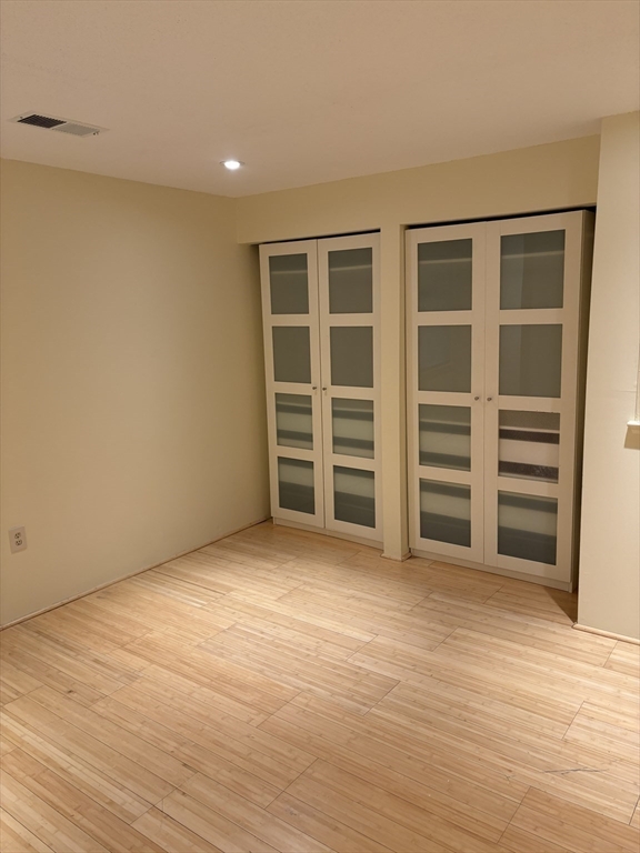 24 Silver Hill Lane, Unit 24 Natick, MA 01760 - Photo 11 of 15 a view of wooden floor and windows in a room