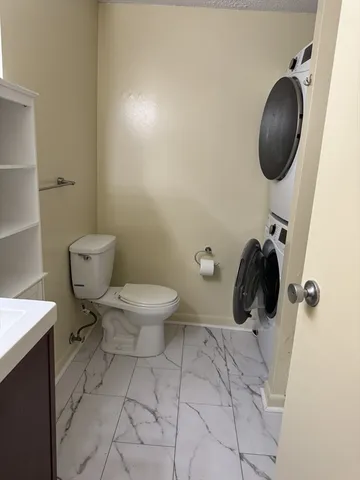 a bathroom with a toilet and a sink