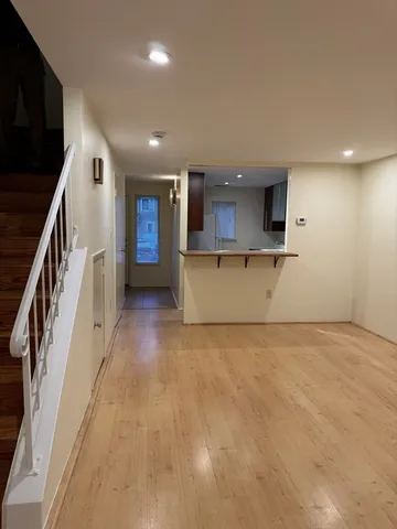 a view of a kitchen with a sink and dishwasher a fireplace