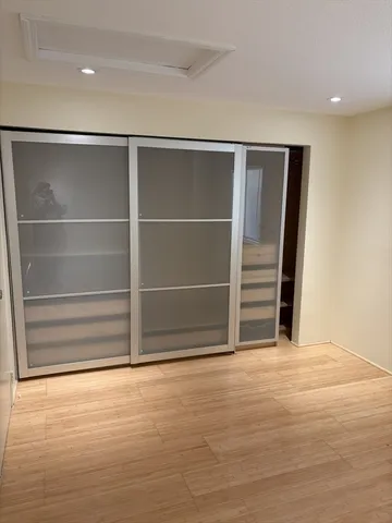 a view of an empty room with empty shelves