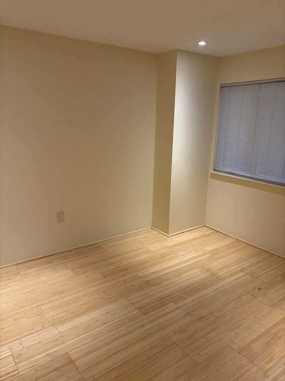 24 Silver Hill Lane, Unit 24 Natick, MA 01760 - Photo 10 of 15 a view of an empty room with wooden floor