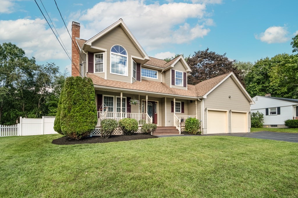 140 Patton Road Woonsocket, RI 02895 - Photo 3 of 42 a front view of a house with a garden