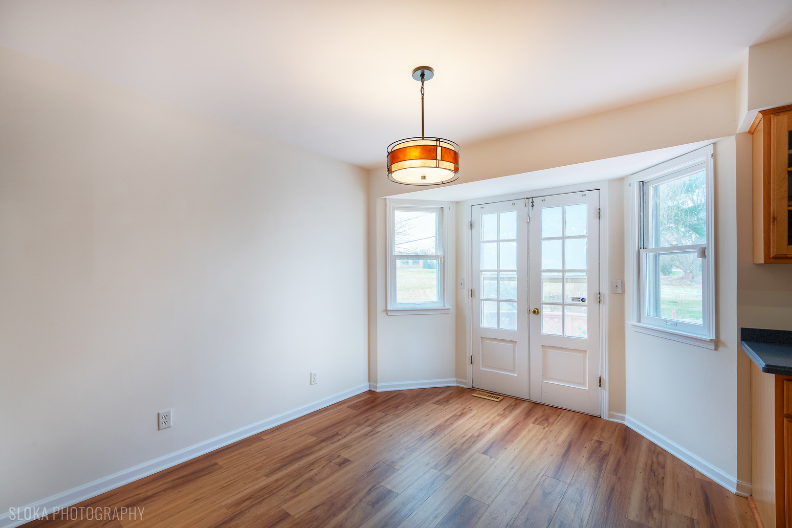 508 Crest Drive Cary, IL 60013 - Photo 11 of 35 a view of an empty room with window and wooden floor