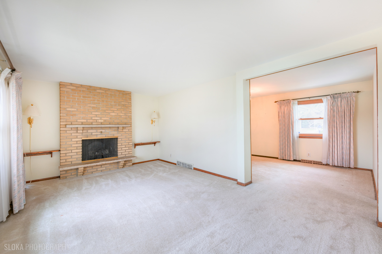 508 Crest Drive Cary, IL 60013 - Photo 3 of 35 an empty room with windows and fireplace