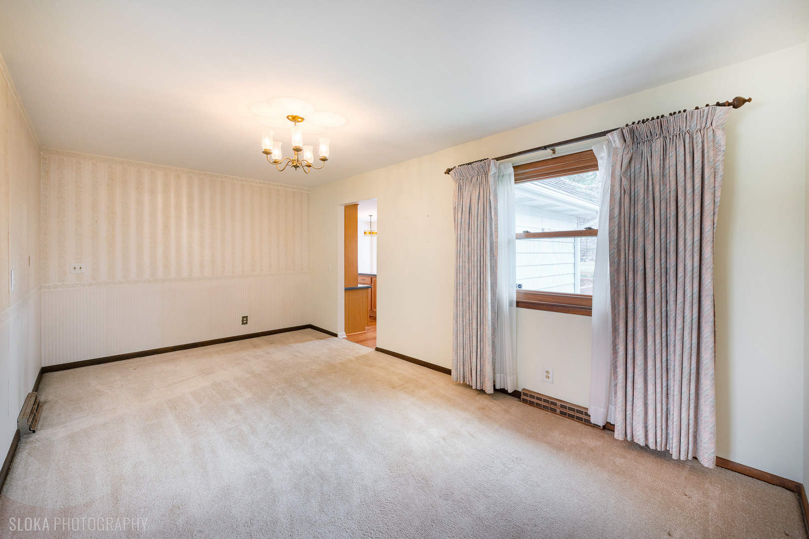 508 Crest Drive Cary, IL 60013 - Photo 6 of 35 an empty room with chandelier fan and windows
