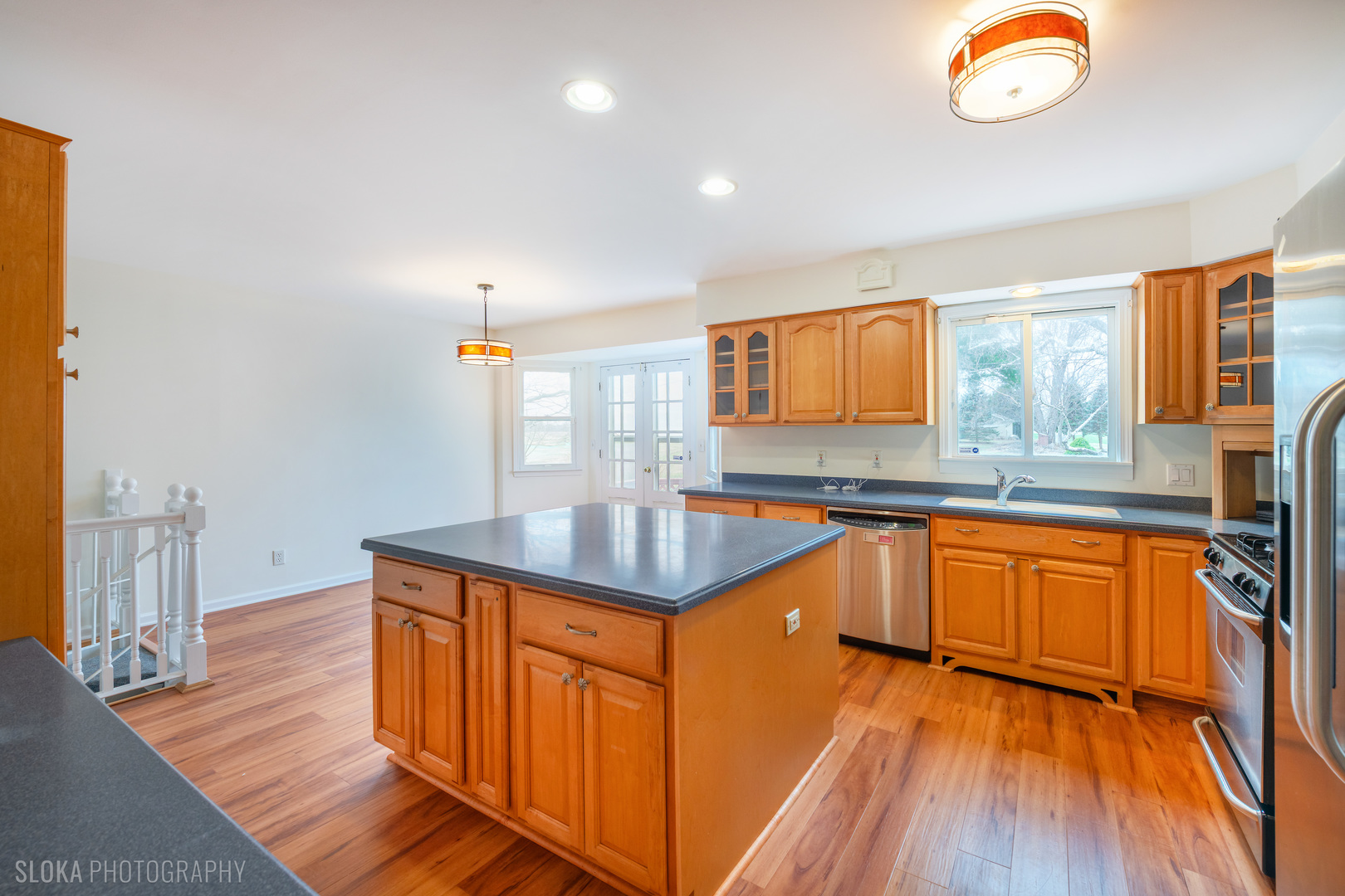 508 Crest Drive Cary, IL 60013 - Photo 7 of 35 a kitchen with granite countertop a stove top oven and cabinets