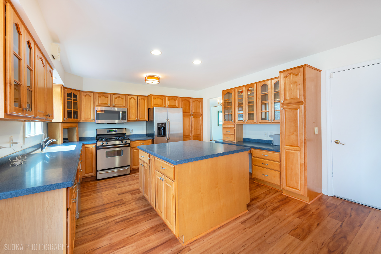 508 Crest Drive Cary, IL 60013 - Photo 8 of 35 a kitchen with stainless steel appliances granite countertop a stove and a sink