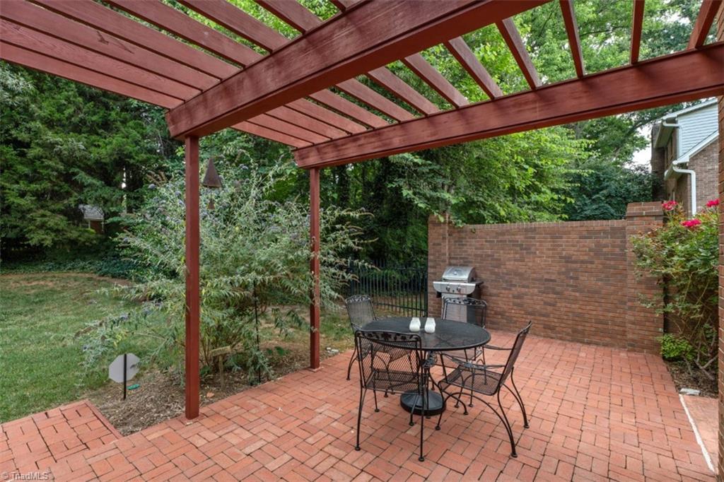 262 Stanaford Road Winston-Salem, NC 27104 - Photo 41 of 47 Brick patio with pergola accessed from sunroom