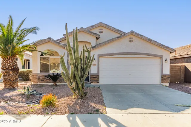 a view of a white house with a outdoor space