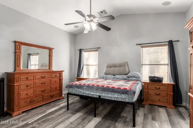 a bedroom with a bed and a dresser