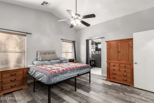 a bedroom with a bed and a dresser