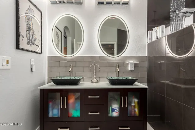a bathroom with a sink and a mirror
