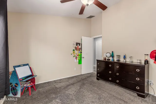 a room with a cabinets and a dresser