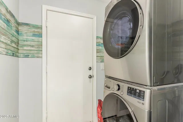 a view of storage and utility room with washer and dryer
