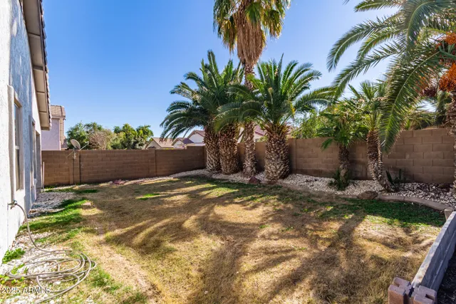 a view of a backyard of a house