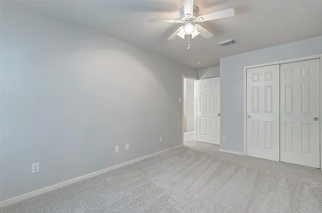 a living room with furniture pool table and a window