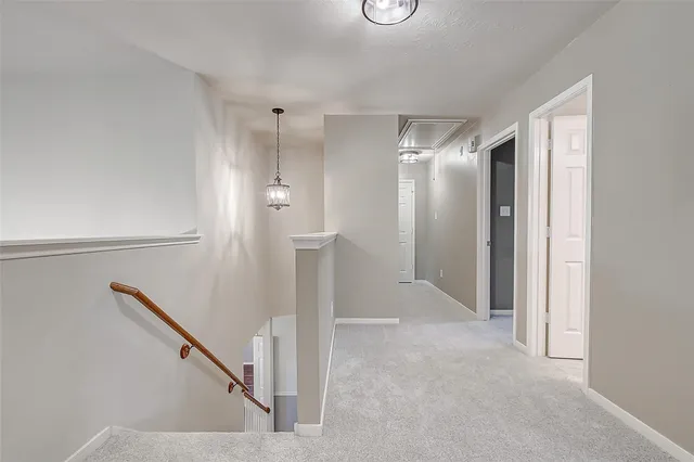 a view of a backyard with wooden fence