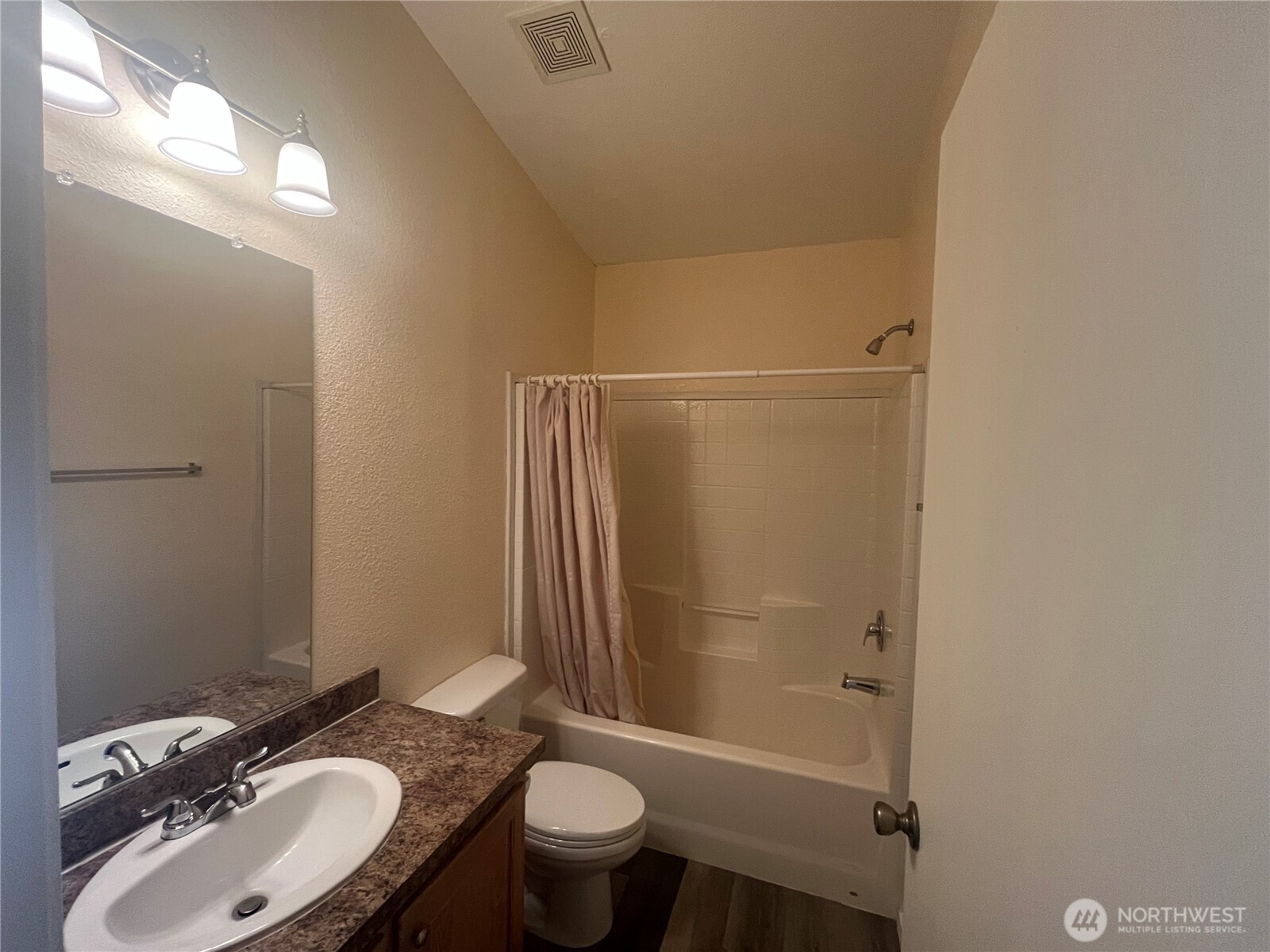 920 Castle Avenue Winthrop, WA 98862 - Photo 15 of 40 a bathroom with a granite countertop sink toilet and shower