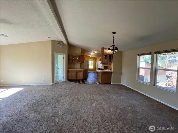 a view of an empty room with a window